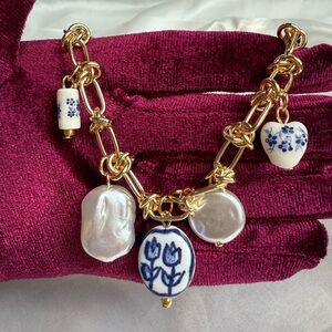 Anthropologe Gold and Blue Charm Necklace
